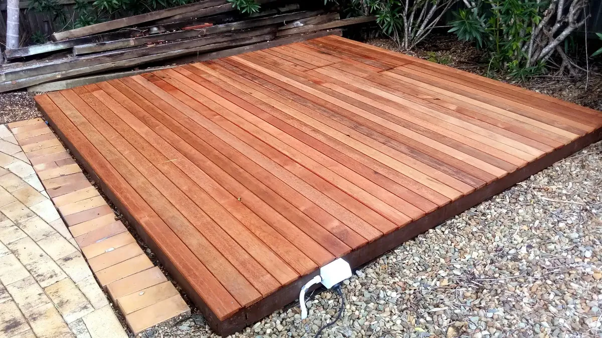 the same timber deck after restoration, sanded back and re-oiled